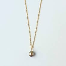Load image into Gallery viewer, Gold necklace with a single pearl pendant on a light gray background