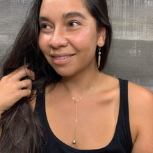 Load image into Gallery viewer, green pearl and gold chain lariat necklace on a model